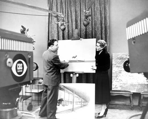 VICTOR GRUEN (1903-1980). Austrian-born American architect. Gruen showing a model of a shopping center to American businesswoman Elizabeth Arden at a CBS television studio. Photograph, c1955.  Copyright: xGRANGERx xGRANGERx 0643367