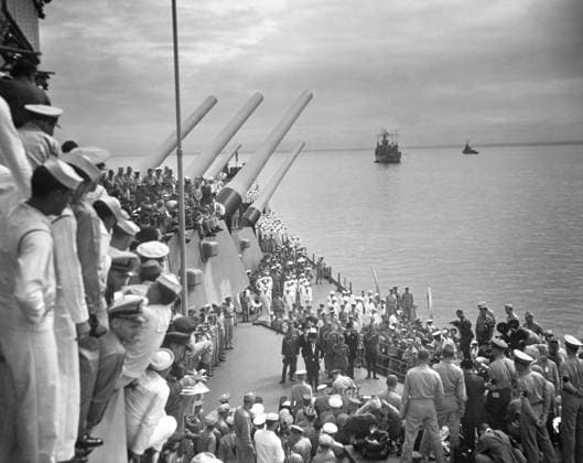 JAPANESE SURRENDER, 1945. Admiral Conrad E.L. Helfrich signing the Instrument of Surrender on behalf of the Netherlands during the formal surrender of the Empire of Japan onboard the USS Missouri. General Douglas MacArthur stands beside him as a crowd of spectators looks on. Photograph, 2 September 1945.  Copyright: xGRANGERx xGRANGERx 0644764