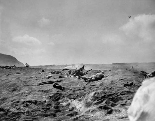 WWII: IWO JIMA, 1945. Marines advancing up a beach during the amphibious landings at Iwo Jima. Photograph from the United States Marine Corps, February 1945.  Copyright: xGRANGERx xGRANGERx 0644931