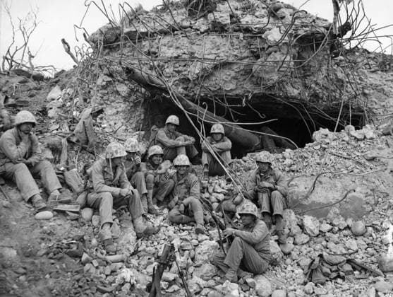 WWII: IWO JIMA, 1945. American Marines resting beneath the remains of a Japanese gun emplacement during the Battle of Iwo Jima. Photograph from the United States Marine Corps, 1945.  Copyright: xGRANGERx xGRANGERx 0644944