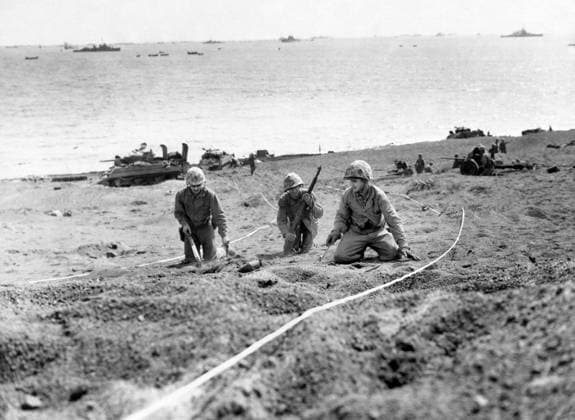 WWII: IWO JIMA, 1945. Marines scouting a minefield on an Iwo Jima beach during the American assault on the island. Photograph from the United States Marine Corps, February 1945.  Copyright: xGRANGERx xGRANGERx 0644945