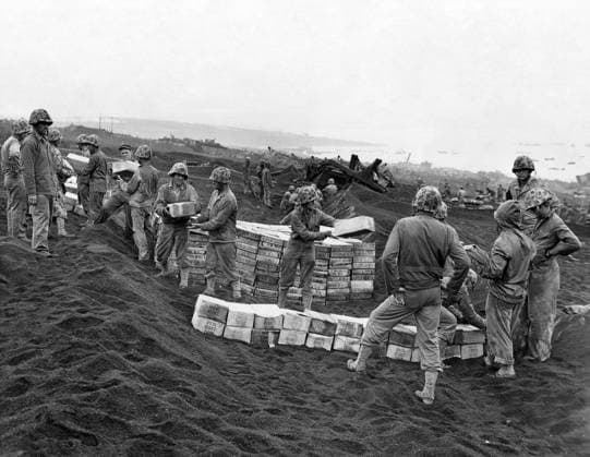 WWII: IWO JIMA, 1945. Marines stack boxes of rations on an Iwo Jima beachhead during the American assault on the island. Photograph from the United States Marine Corps, February 1945.  Copyright: xGRANGERx xGRANGERx 0644947