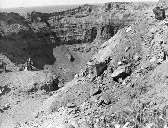 WWII: IWO JIMA, 1945. American Marines stand at the edge of a sulphur pit on the island of Iwo Jima, partially demolished by high explosives in an attempt to flush out Japanese defenders in nearby caves. Photograph from the United States Marine Corps, 1945.  Copyright: xGRANGERx xGRANGERx 0645027