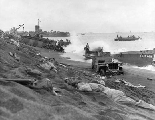 WWII: IWO JIMA, 1945. Fallen Marines and the wreckage of vehicles and landing craft left in the wake of the American amphibious assault on Iwo Jima. Photograph from the United States Marine Corps, February 1945.  Copyright: xGRANGERx xGRANGERx 0645081