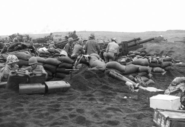 WWII: IWO JIMA, 1945. United States marines preparing 105 mm gun positions during the first day of the invasion of Iwo Jima. Photograph by Karl Thayer Soule, 19 February 1945.  Copyright: xGRANGERx xGRANGERx 0651633