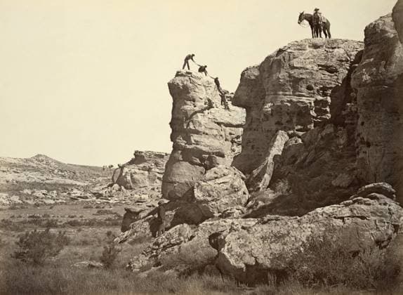 WYOMING: HIGH BLUFF, 1869. Men climbing on the rocks at High Bluff, Black Buttes, Wyoming. Photograph by Andrew Joseph Russell, 1869.  Copyright: xGRANGERx xGRANGERx 0652829