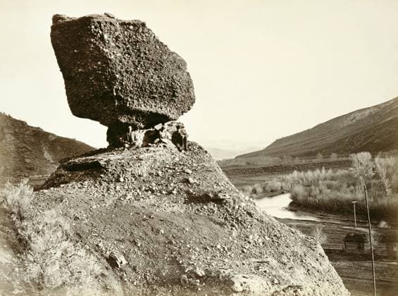SPHYNX OF THE VALLEY, 1869. Three men sitting on the rock formation zknown as the Sphynx of the Valley, Utah. Photograph by Andrew Joseph Russell, 1869.  Copyright: xGRANGERx xGRANGERx 0652890