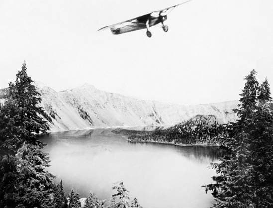 SPIRIT OF ST. LOUIS, 1927. Charles A. Lindbergh s Spirit of St. Louis flight over Crater Lake, Oregon. Photograph, 1927.  Copyright: xGRANGERx xGRANGERx 0653839