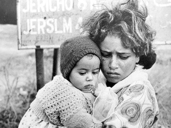 Israel Palestine: Palestinian children driven from their homes by Israeli forces huddle beneath a Jersualem road sign, 1948. Photo by George Nemeh (CC BY-SA 3.0 License) The 1948 Palestinian exodus, known in Arabic as the Nakba (Arabic: ØßÙ ÙÜÙƒØ¨Ø Ž, an-Nakbah, lit. catastrophe ), occurred when more than 700,000 Palestinian Arabs fled or were expelled from their homes, during the 1947 1948 Civil War in Mandatory Palestine and the 1948 Arab Israeli War.<br ><br > The exact number of refugees is a matter of dispute, but around 80 percent of the Arab inhabitants of what became Israel (50 percent of the Arab total of Mandatory Palestine) left or were expelled from their homes.<br ><br > Later in the war, Palestinians were forcibly ex Copyright: xGeorgexNemehx(CCxBY-SAx3.0xLicenxPicturesxFromxHistoryx