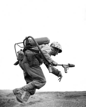 USA Japan: A US marine carrying a flame-thrower sprints towards a Japanese pillbox at Motoyama Airfield, Iwo Jima, February 1945 The invasion of Iwo Jima began on February 19, 1945, and continued to March 27, 1945. The battle was a major initiative of the Pacific Campaign of World War II. The Marine invasion was charged with the mission of capturing the airfields on the island, which up until that time had harried U.S. bombing missions to Tokyo. Once the bases were secured, they could then be of use in the impending invasion of the Japanese mainland.<br ><br > The battle was marked by some of the fiercest fighting of the War. The Imperial Japanese Army positions on the island were heavily fortified, with vast bunkers, hidden artillery, a Copyright: xUSxMarinexCorpsxPicturesxFromxHistoryx