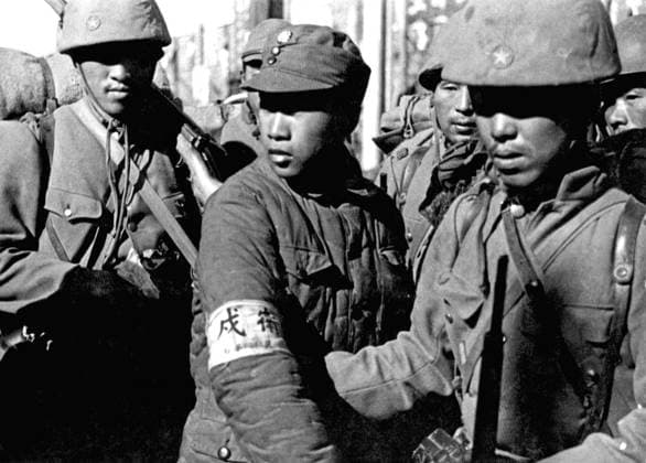 China Japan: Imperial Japanese soldiers flank a Chinese soldier captured at the Battle of Nanking (Nanjing) prior to his execution, December 1937 The Nanking Massacre or Nanjing Massacre, also known as the Rape of Nanking, is a mass murder and war rape that occurred during the six-week period following the Japanese capture of the city of Nanjing (Nanking), the former capital of the Republic of China, on December 13, 1937 during the Second Sino-Japanese War.<br ><br > During this period, hundreds of thousands of Chinese civilians and disarmed soldiers were murdered and 20,000 80,000 women were raped by soldiers of the Imperial Japanese Army. Copyright: xxPicturesxFromxHistoryx