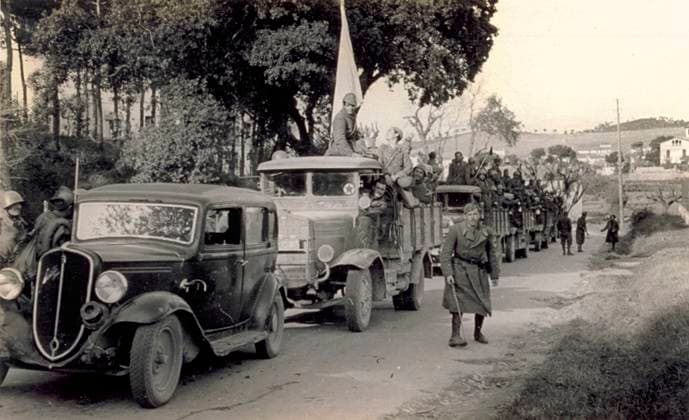 A column of military vehicles moving in the direction of Badalona, 01-02 1939 (b w photo) 1249966 A column of military vehicles moving in the direction of Badalona, 01-02 1939 (b w photo) by Unknown photographer, (20th century); (add.info.: Unidentified Author Spain); Fratelli Alinari Museum Collections, Florence, Italy. Copyright: xFratellixAlinarixMuseumxCollections,xFlorence,xItalyx xBridgemanxImagesx 1249966