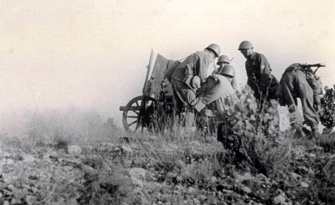 A few Italian soldiers commanded by captain Tognetti busy setting up and aiming a cannon against the enemy during the action known as Del Levante on the afternoon of July 14, 1938 (b w photo) 1250022 A few Italian soldiers commanded by captain Tognetti busy setting up and aiming a cannon against the enemy during the action known as Del Levante on the afternoon of July 14, 1938 (b w photo) by Unknown photographer, (20th century); (add.info.: Unidentified Author Spain); Fratelli Alinari Museum Collections, Florence, Italy. Copyright: xFratellixAlinarixMuseumxCollections,xFlorence,xItalyx xBridgemanxImagesx 1250022
