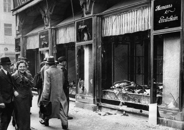 Germany: Shattered storefront of a Jewish-owned shop destroyed during Kristallnacht, Berlin, 1938. Photo by George Pahl (CC BY-SA 3.0 DE License) Kristallnacht or Crystal Night , also referred to as the Night of Broken Glass, was a pogrom against Jews throughout Nazi Germany and Austria that took place on 9 10 November 1938, carried out by SA (Sturmabteilung or Brownshirts) paramilitary forces and German civilians.<br ><br > German authorities looked on without intervening. The name Kristallnacht comes from the shards of broken glass that littered the streets after Jewish-owned stores, buildings, and synagogues had their windows smashed. Copyright: xGeorgexPahlx(CCxBY-SAx3.0xDExLicxPicturesxFromxHistoryx