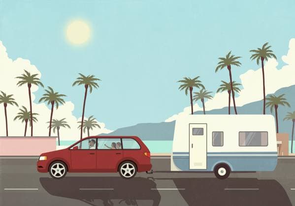 Family on vacation in car, pulling camper trailer along sunny palm trees and ocean  Copyright: MaltexMueller fStopImages2070052