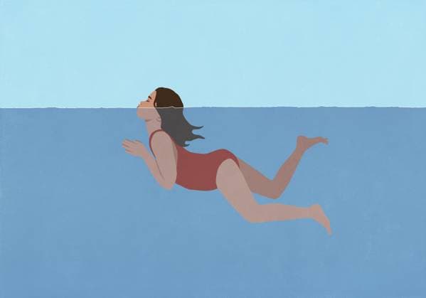 Girl in bathing suit swimming with head above water  Copyright: MaltexMueller fStopImages2070064