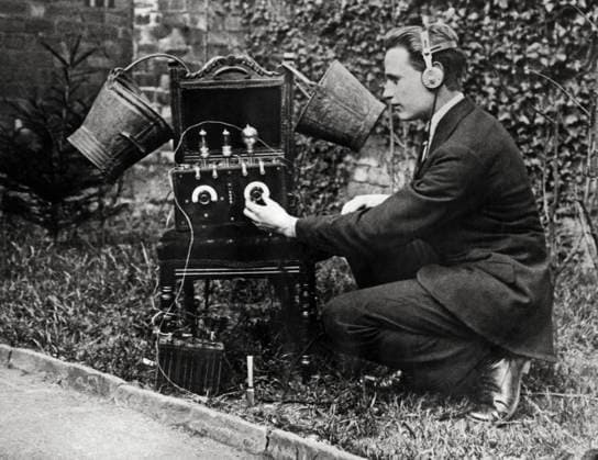 RECORD DATE NOT STATED Tin Pails For Radio Antennas Sheffield, England c 1923 This radio fan is able to pick up London and Manchester quite easily with his unique set of two tin pails as aerials for his wireless receiving set in his garden in Sheffield. Copyright: Â¬ xUnderwoodxArchives 990_05_2-Radio-List_18HR