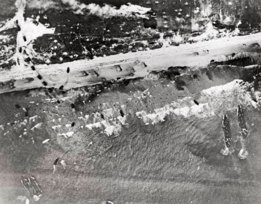 RECORD DATE NOT STATED D-Day Invasion Proceeds Normandy, France, June 10, 1944 Assault craft belch their cargo of soldiers onto the invasion beaches at Normandy in France. Small specks seen in the white-capped water are troops wading toward shore. Tanks and other motor vehicles have already started the drive inland. Larger craft wait offshore as the battle for the liberation of Europe proceeds according to plan. Copyright: Â¬ xUnderwoodxArchives 990_05_4-WWII-US-E-DDay_26HR
