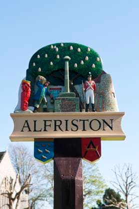 Alfriston Village Sign, UK The village sign at Alfriston, UK, a popular place with tourists and coach tours due to it s attractive old buildings Copyright: xZoonar.com MickxHousex 9101369