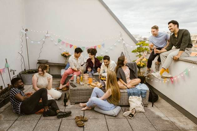 Group of multiracial friends having fun while celebrating during party in decorated balcony Germany, Berlin, model released, property released Copyright: xMaskotx , MA108152 MA108152