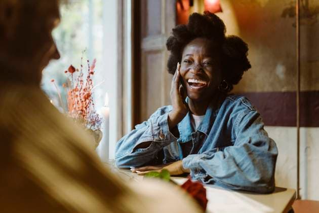 Creative Highlights Symbolbilder Happy woman laughing while sitting with boyfriend during date at bar Germany, Berlin, model released, property released Copyright: xMaskotx , MA108402 MA108402