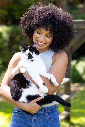 Creative Highlights Symbolbilder Biracial young woman holding black and white cat, both outdoors at home in garden Biracial young woman holding black and white cat, both outdoors at home in garden. She has curly hair, wearing sleeveless top and jeans, smiling at cat, unaltered, model released, , property released, Cape Town, South Africa, 2024-03-14T22:00:00.000Z, 5197912.jpg, people,biracial,young woman,holding,black and white,white cat,outdoors,home garden,curly hair,wearing,sleeveless top,jeans,smiling,cheerful,happy,young,lifestyle,adult,happiness,person,portrait,casual,attractive,looking,leisure,view,fun,together,summer,sitting,beautiful,day,nature,park,pretty,standing,women,joy,outside,family,woman,black,white,cat,home,garden,curly,hair Young Adult,Woman,Female,Mixe