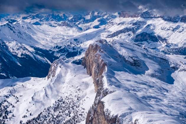 Snow-covered summits of alpine Dolomite landscape around Falzarego pass in winter, seen from Mt. Lagazuoi. Cortina d˜Ampezzo Veneto Italy FB_2024_0911