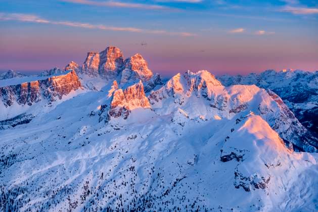 The snow-covered summit of Mt. Pelmo, surrounded by alpine Dolomite landscape around Falzarego pass in winter, seen from Mt. Lagazuoi at sunset. Cortina d˜Ampezzo Veneto Italy FB_2024_0939