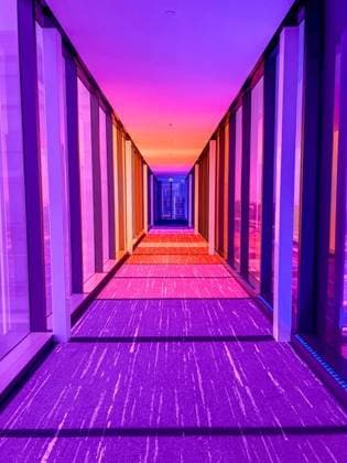 Creative Highlights World Sunset illuminating corridor leading to a building 23969163 RECORD DATE NOT STATED