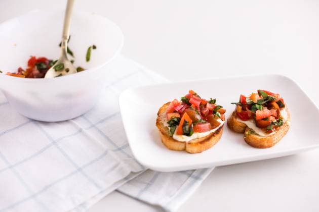 Cheese tomato basil bruschetta on plate Coeur d Alene, Idaho, United States R_PXQG240416E6-1402816-01