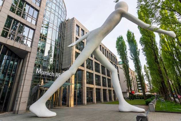 sculpture Walking Man by Jonathan Borofsky in front of a building of Münchener Rückversicherungs-Gesellschaft Aktiengesellschaft in München (Münchener Rück, Munich Re) München, Munich Oberbayern, Upper Bavaria Bayern, Bavaria Germany
