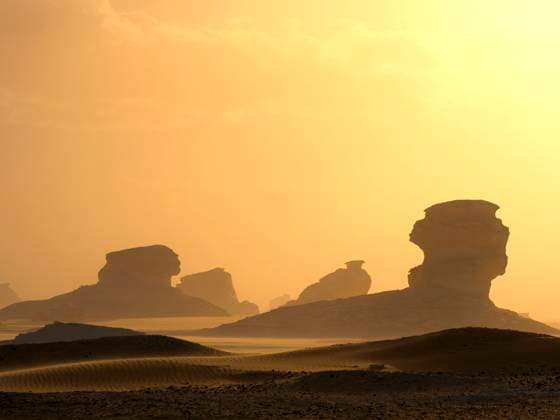 Creative Highlights World Limestone rock formations under sky in Sahara desert at sunset, Egypt, DSGF02536
