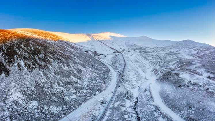 UK, Scotland, Aviemore, Aerial view of ski slope in Cairngorm Mountains, Aviemore Scotland United Kingdom SMAF02716
