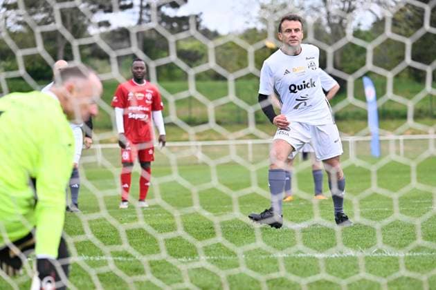 Macron Takes Part In Charity Football Match - Plaisir President Emmanuel Macron (R) scores a penalty kick during the Varietes Club charity football match to benefit children in hospital, in Bernard Giroux stadium, in Plaisir, outside Paris, France on April 24, 2024. Photo by Eric Tschaen Pool ABACAPRESS.COM Plaisir IDF France  Copyright: xTschaenxEric Pool ABACAx