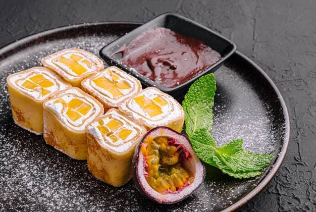 Delicious fruit sushi rolls in pancake with cottage cheese Delicious fruit sushi rolls in pancake with cottage cheese Copyright: xZoonar.com AntonxDobreax 21365874