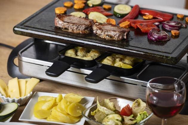 swiss raclette with meat and vegetables swiss raclette with meat and vegetables Copyright: xZoonar.com BerndxJuergensx 21386988