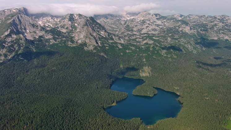 Famous Black Lake in Durmitor park Aerial view of famous Black Lake in mountain Durmitor park at summer, Montenegro Copyright: xZoonar.com MikhailxKokhanchikovx 21445784