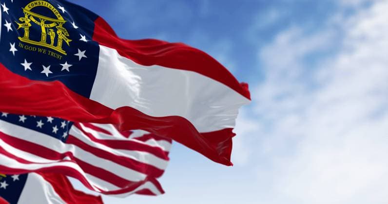 Flags of Georgia and United States waving in the wind on a clear day Flags of Georgia and United States waving in the wind on a clear day. Georgia is a state in the southeastern US. US federate state. 3d illustration render. Fluttering textile Copyright: xZoonar.com ValerioxRosatix 21481539