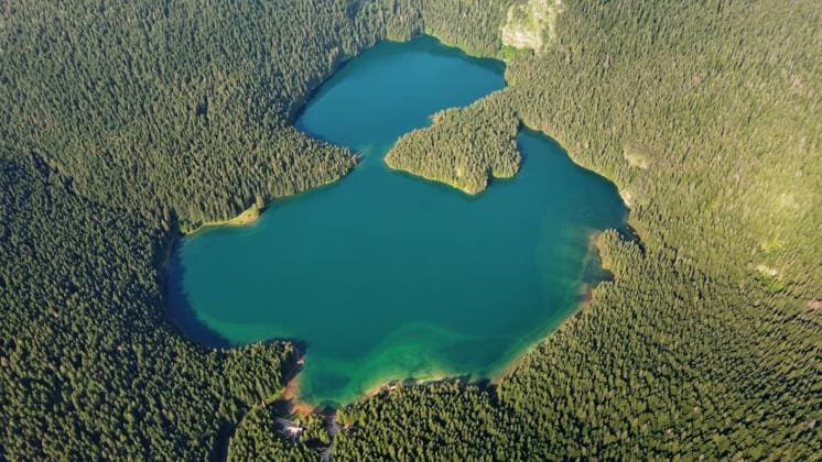Famous Black Lake in Durmitor park Aerial view of famous Black Lake in mountain Durmitor park at summer, Montenegro Copyright: xZoonar.com MikhailxKokhanchikovx 21481926