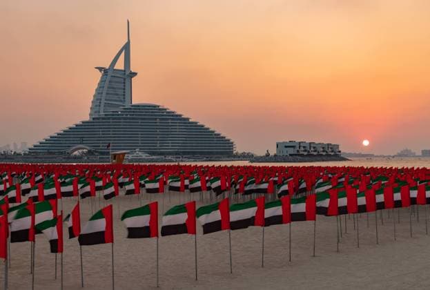 United Arab Emirates Flags, Jumeirah Public Beach, Jumeirah Marsa Al Arab Hotel and Burj Al Arab Hotel at Sunset A picture of many United Arab Emirates flags at the Jumeirah Public Beach, with the Jumeirah Marsa Al Arab Hotel and the Burj Al Arab Hotel in the far center, at sunset. Copyright: xZoonar.com BrunoxCoelhox 21508857