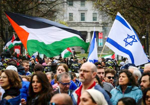 May 2, 2024, Montreal, Quebec, Canada: On Day 6 of McGill encampment, pro-Palestinian and pro-Israel protesters face off. Police in riot gear have lined up at campus entrance, keeping both groups separate. Montreal Canada - ZUMAs278 20240502_zip_s278_009 Copyright: xSerkanxSenturkx