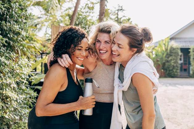 Happy female friends embracing each other at wellness resort Thailand, Ko Lanta, model released, property released Copyright: xMaskotx , MA109081 MA109081
