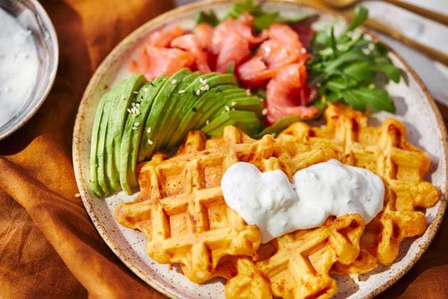 Hearty sweet potato or pumpkin waffles with avocado, salmon, arugula and sauce Hearty sweet potato or pumpkin waffles with avocado, salmon, arugula and sauce Copyright: xZoonar.com BurakovaxIrinax 21517996