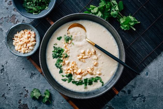 Spicy and creamy cauliflower and coconut soup with cilantro and macadamia nuts Spicy and creamy cauliflower and coconut soup with cilantro and macadamia nuts Copyright: xZoonar.com IngridxBalabanovax 21591819
