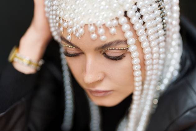 Sensual woman with make up and a wig of pearls High angle view of a sensual woman with make up and a wig of pearls Copyright: xIvanxMorenox-xwww.ivanmorenosl.c