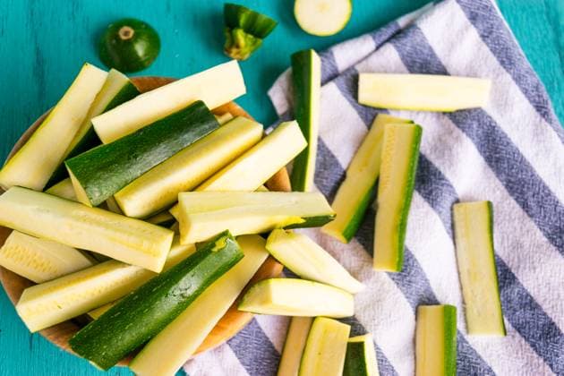 Fresh zucchini sticks prepped on vibrant teal background! Sacramento, California, United States R_OCZQ240507B2-1420340-01