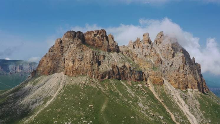Creative Highlights World Mother-in-law teeth Caucasus mountain Aerial view on Naujiza or Mother-in-law teeth mountain with fantastic cliffs in Kabardino-Balkaria, Caucasus, Russia Copyright: xZoonar.com MikhailxKokhanchikovx 21609017