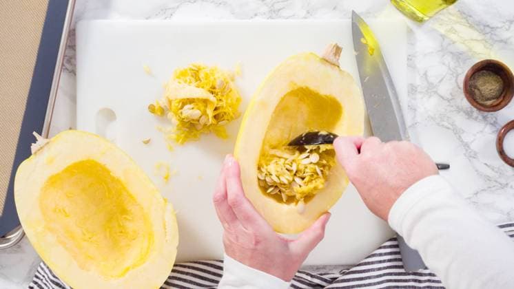 Spaghetti squash Step by step. Flat lay. Preparing organic spaghetti squash with olive oil, salt, and pepper. Copyright: xArinaxHabich RECORD DATE NOT STATED
