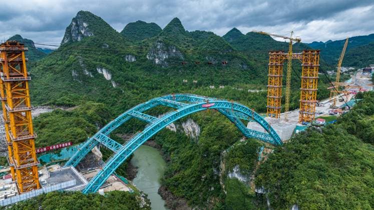 News Themen der Woche KW19 News Bilder des Tages (240510) -- PINGTANG, May 10, 2024 -- An aerial drone photo taken on May 10, 2024 shows the construction site of the Lami River bridge along the Guiyang-Pingtang expressway in southwest China s Guizhou Province. The bridge, with a total length of 206 meters, saw its arch ribs closed on Friday. ) CHINA-GUIZHOU-EXPRESSWAY-BRIDGE-CONSTRUCTION (CN) TaoxLiang 