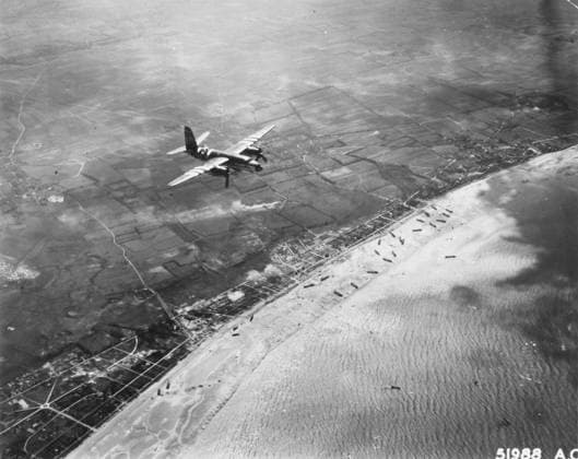 RECORD DATE NOT STATED D-Day - Bomber giving air support to infantry invasion A B-26 Martin Marauder of the 9th Airforce over the Normandy coast, giving air support to the landing craft on the beaches below. D-Day began on June 6th, 1944 at 6:30am and was conducted in two assault phases  Copyright: Copyrightx(c)Geminix2023.xCredit:xGemini 10282397